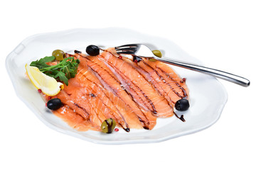 Sliced salmon on a plate on an isolated white background