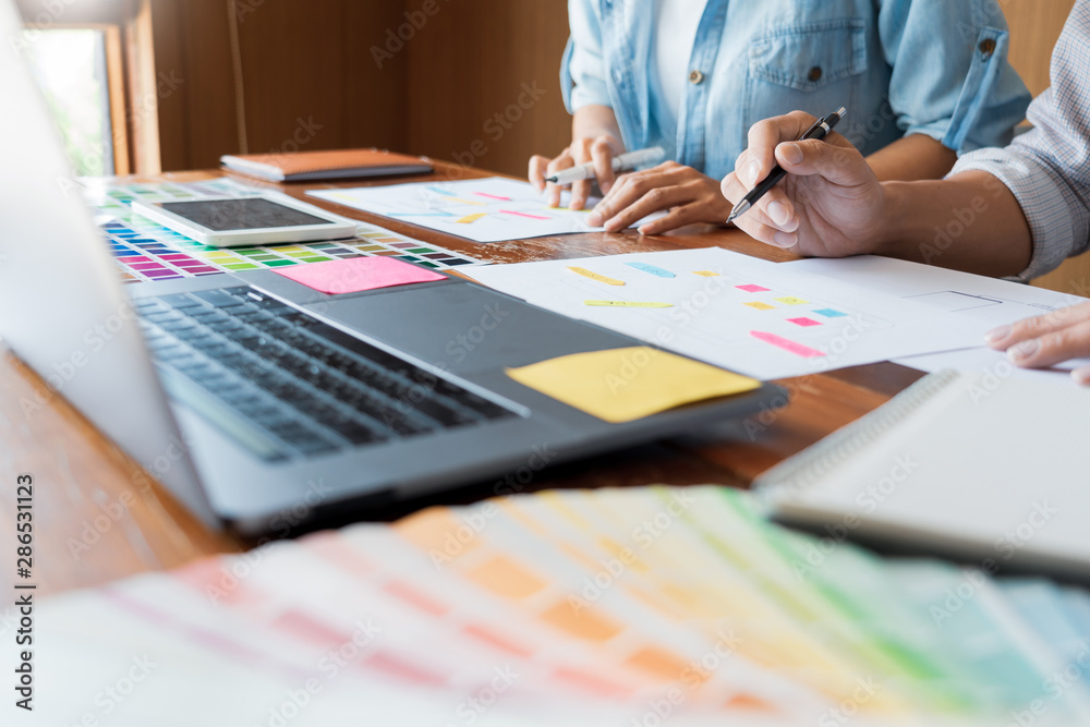 Wall mural business technology concept, creative team designer choosing samples with ui/ux developing on sketch