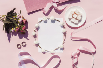 Flat lay pink wedding arrangement with on background