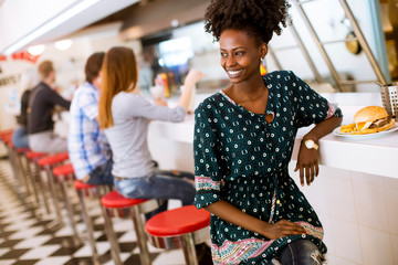 Young african american woman in the diner