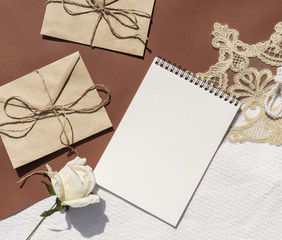 Minimalist wedding arrangement with empty notepad