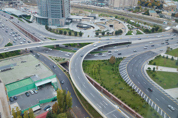 Fototapeta na wymiar Bridges, roads. Top view . Aerial view of highway and overpass in city .Aerial photo of urban elevated road junction and interchange overpass in city with light traffic