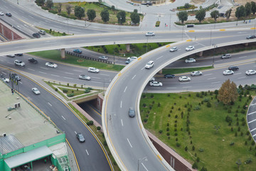 Bridges, roads. Top view . Aerial view of highway and overpass in city .Aerial photo of urban elevated road junction and interchange overpass in city with light traffic