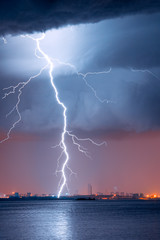 strong thunderstorm with lightning over the city