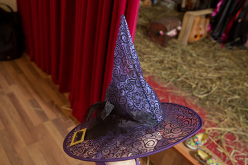 Preparation for the celebration of Halloween . Purple witch hat .