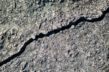 The structure of the old concrete slab with a crack.