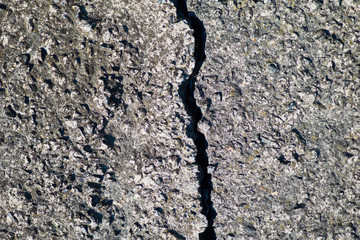 The structure of the old concrete slab with a crack.