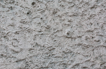 Wall pattern. City background. The texture of the building. Uneven surface