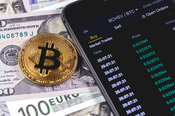 bitcoin, money and smartphone with cryptocurrency stock market 