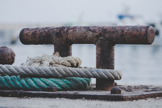 Ropes of a ship tied to a hitch clip in a port