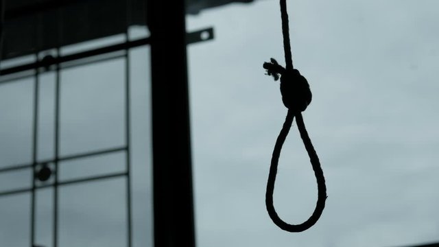 Silhouette of Hangman's noose knot. commit suicide concept.