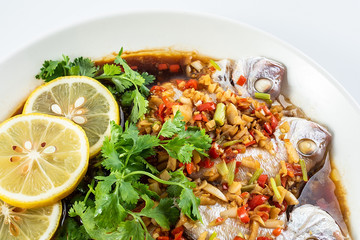 Chinese dish of hot chilli steamed red squid on white background