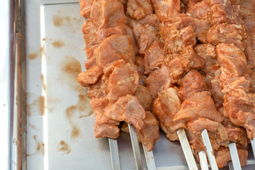 Appetizing marinated pork skewers prepared for roasting. Cooking barbecue in spicy sauce