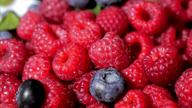 Close Up Rotation Loopable Raspberry. Fresh, Juicy Raspberry Background, Ripe. Macro Red Raspberries Fruit. Fresh Raspberry Fruits As Food Dackground. Healthy Food Organic Nutrition.