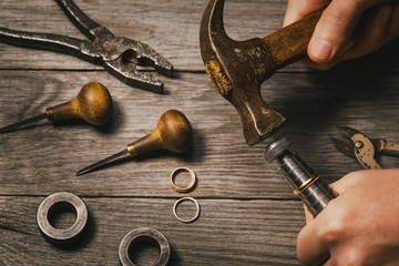 The workflow of increasing the gold ring in a jewelry workshop, close-up
