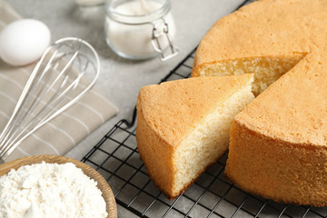 Delicious fresh homemade cake on grey marble table, closeup