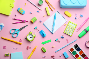 Bright school stationery on pink background, flat lay