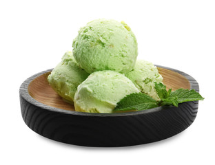 Plate of delicious pistachio ice cream on white background