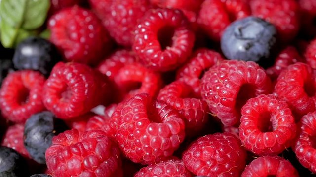 Close Up Rotation Loopable Raspberry. Fresh, Juicy Raspberry Background, Ripe. Macro Red Raspberries Fruit. Fresh Raspberry Fruits As Food Dackground. Healthy Food Organic Nutrition.