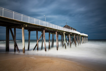 Old wooden fishing pier out to ocean