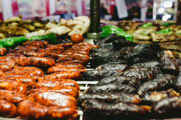 Sausages and black pudding roasted in a barbecue.