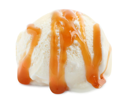 Scoop of delicious ice cream with caramel sauce on white background