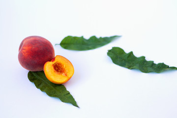 fresh peach with leaves isolated on white background