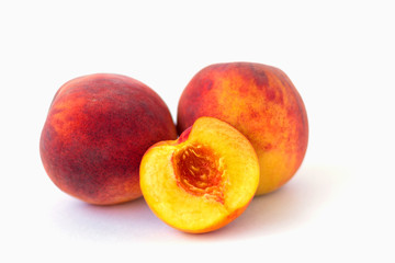 ripe peaches isolated on white background