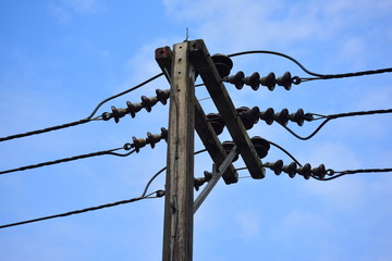 Electricity poles and high transmission lines and the sky is beautiful