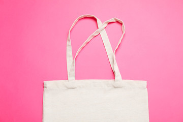Eco bag on color background, space for text