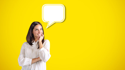 Smiling woman imagines something pleasant inside a text bubble