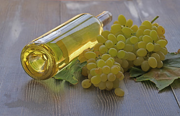 Grapes, white wine and glass