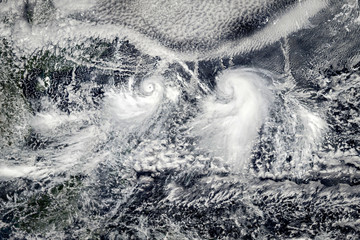 Clouds with tornadoes, view from space. Elements of this image furnished by NASA.