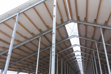 Roof of a cowshed with a window in the middle for better lighting.
