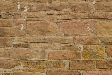 Antique light brown limestone wall texture with thick mortar and grunge look