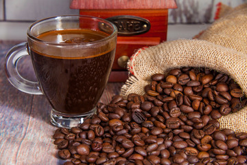 delicious cup of coffee and coffee beans