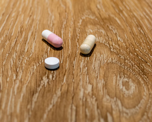 Capsules and pill on table