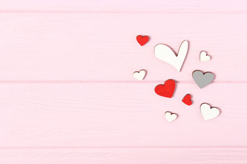 Hearts on a colored background top view. Background for Valentine's Day. Romantic background.