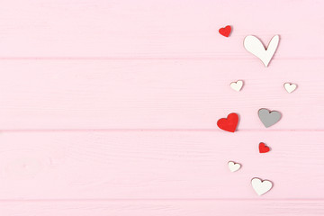 Hearts on a colored background top view. Background for Valentine's Day. Romantic background.