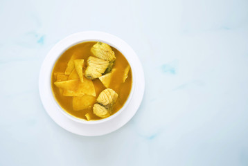 Yellow Curry with fish in bowl on table, Thai cuisine, food Asia concept