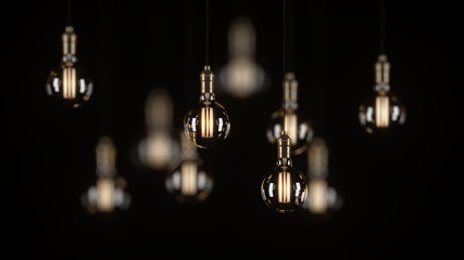 Decorative vintage light bulbs in Edison style on a black background. 3D rendering.