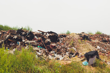 Mountain garbage, large garbage pile, degraded garbage. Pile of stink and toxic residue. These...