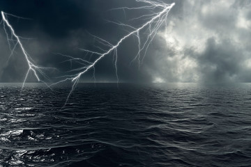 Naklejka na ściany i meble Stormy weather on the ocean with lightning