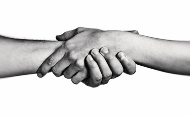 Concept of salvation. Image of the hands of two people at the time of rescue (help). Black and...