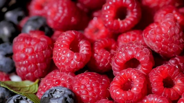 Close Up Rotation Loopable Raspberry. Fresh, Juicy Raspberry Background, Ripe. Macro Red Raspberries Fruit. Fresh Raspberry Fruits As Food Dackground. Healthy Food Organic Nutrition.