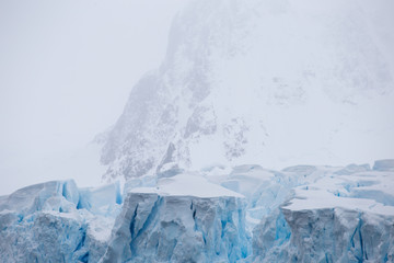Fototapeta na wymiar World climate change problems. Melting glacier. Antarctica amazing white frozen blue landscape. Polar snow
