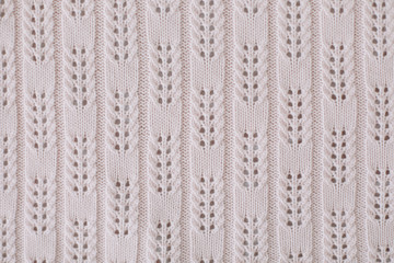 Knitted texture. Knitting pattern of wool. Knitting. Texture of knitted woolen fabric for wallpaper and an abstract background