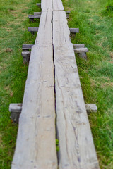 staircase wooden path with railing in the mountain green forest