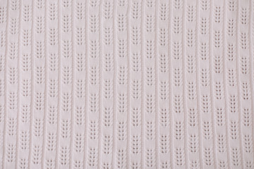 Knitted texture. Knitting pattern of wool. Knitting. Texture of knitted woolen fabric for wallpaper and an abstract background