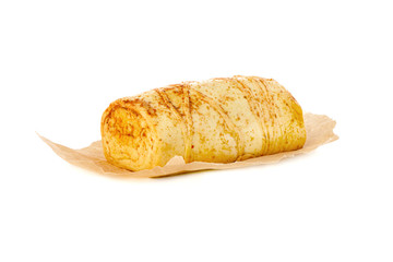 Cheese on parchment paper. Smoked cheese close-up on a white background.